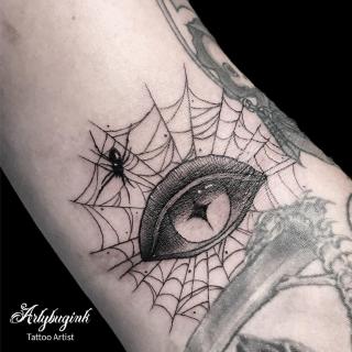 Eye in a spiderweb tattoo by Artybugink